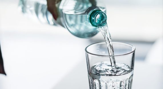 pouring-water-from-pet-bottle-into-a-glass-picjumbo-com